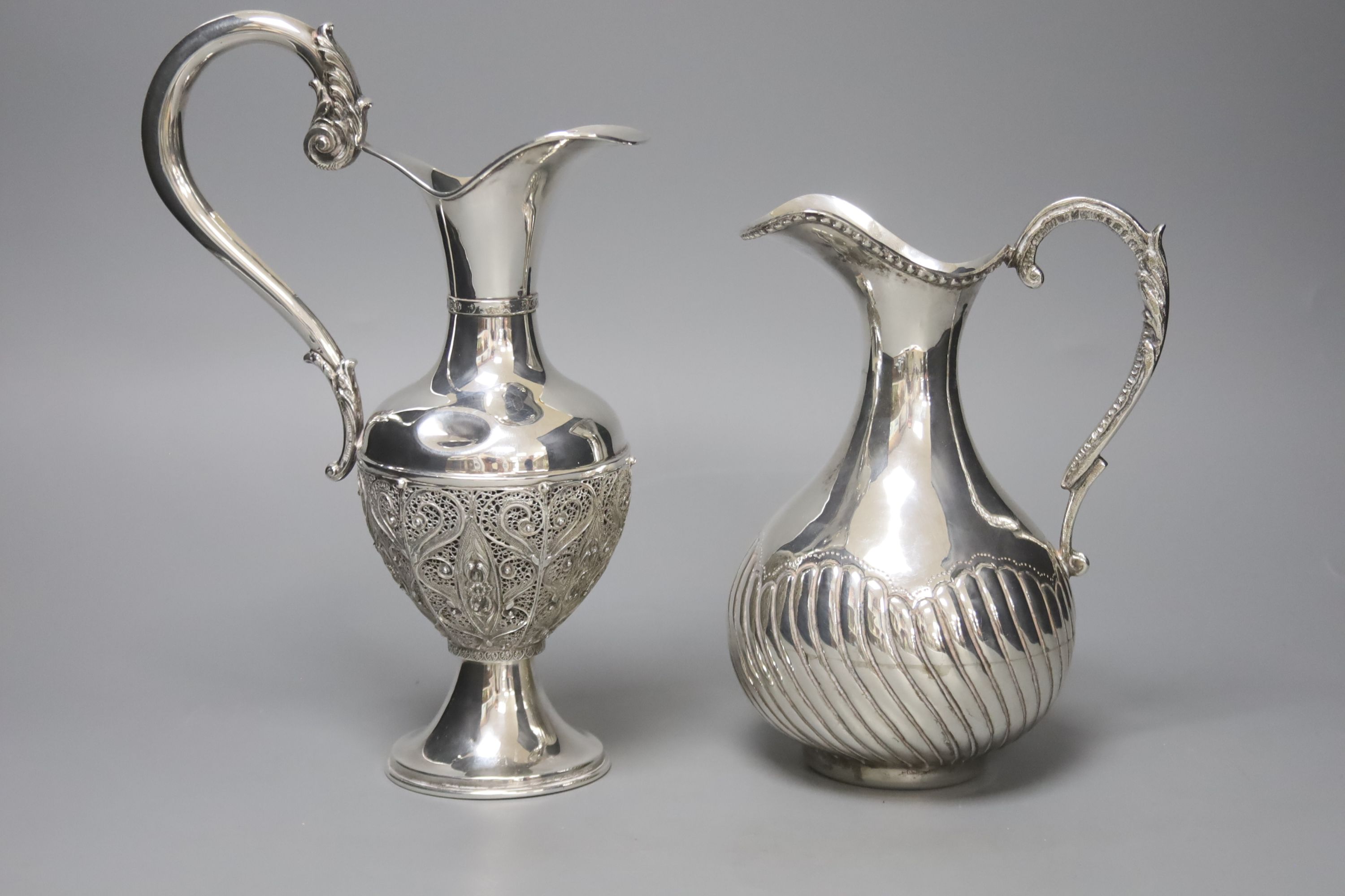 Two silver plated water jugs, height 25cm